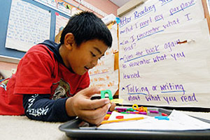 Viers Mill Kindergartner demonstrates his reading ability.